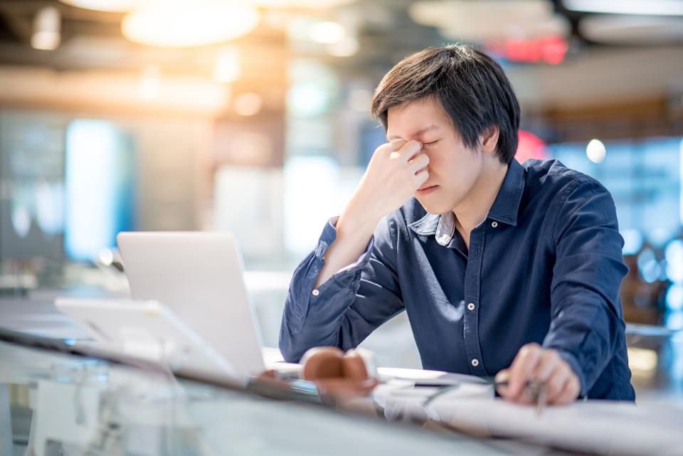 man unhappy at work